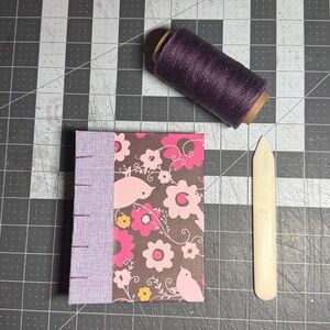 Handmade Coptic Bound Art Journal. Design shown in picture. 128 blank pages.